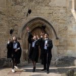 Graduation Day July 2018 - students throw their mortar boards in front of the Library