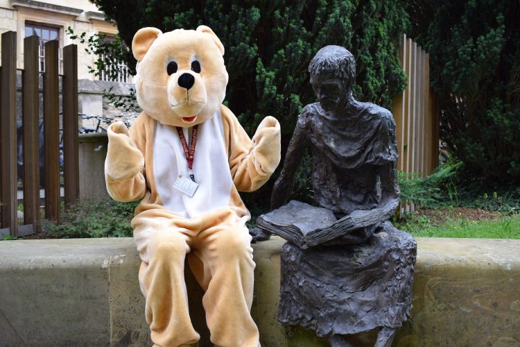 Teddy Hall's bear mascot and a sculpture of our namesake, St Edmund