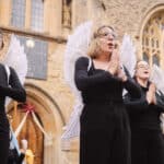 Three performers dressed as angels at the Medieval Mystery Plays