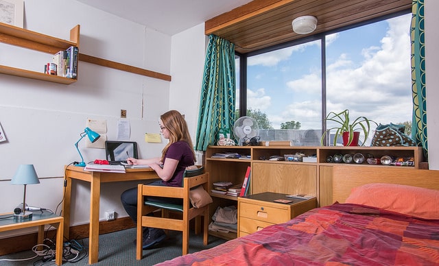 Lizzie in room on Kelly 4 An undergraduate in her room in the Kelly building