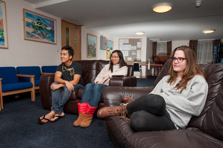 Students relaxing in the Common Room in the William R Miller building on Dawson Street