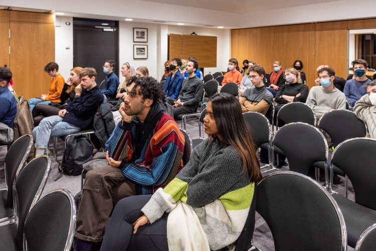 Audience listening to two LGBTQ+ Activists