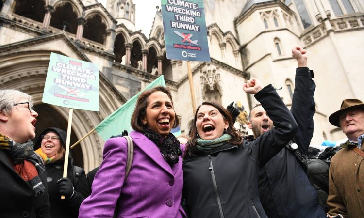 Munira Wilson and Sarah Olney, the MPs for Twickenham and Richmond Park, cheer alongside other campaigners outside the Royal Courts of Justice in London after the ruling