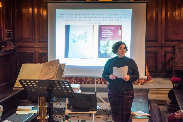 Dr Alex Lloyd giving a talk in the Chapel at the Research Expo