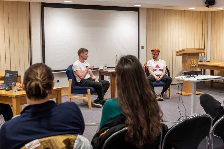 2 LGBTQ Activists talking to students at St Edmund Hall