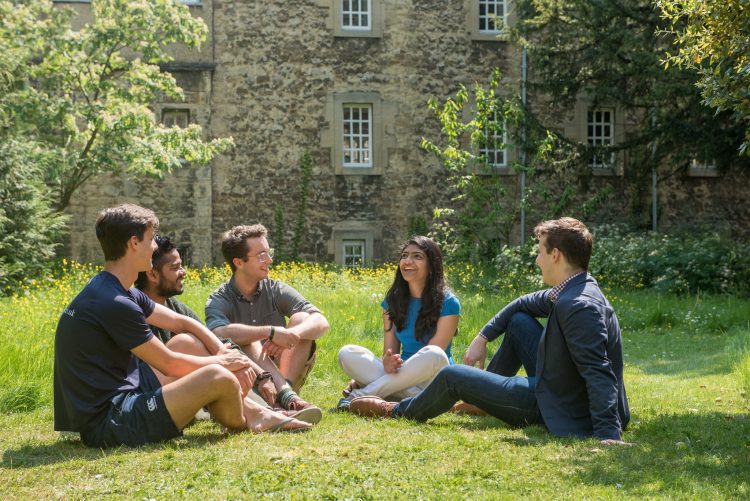 Visiting Students and Postgraduates chatting in the graveyard