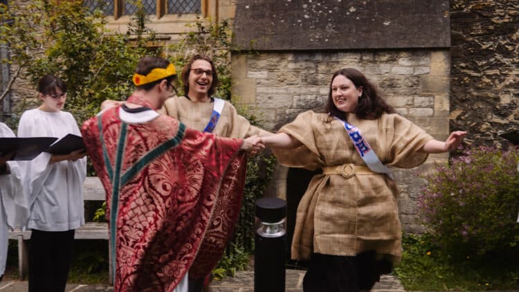 Actors dancing in a circle during the Medieval Mystery Plays performed in 2025