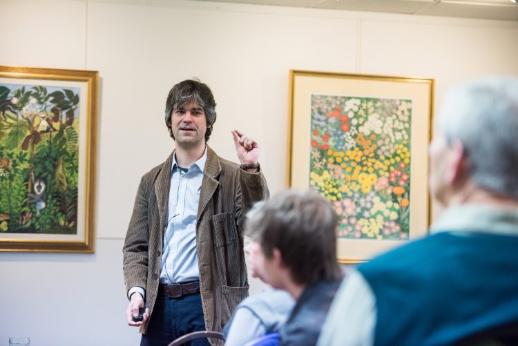 Aris Karastergiou giving a talk in the Pontigny Room at the St Edmund Hall Research Expo