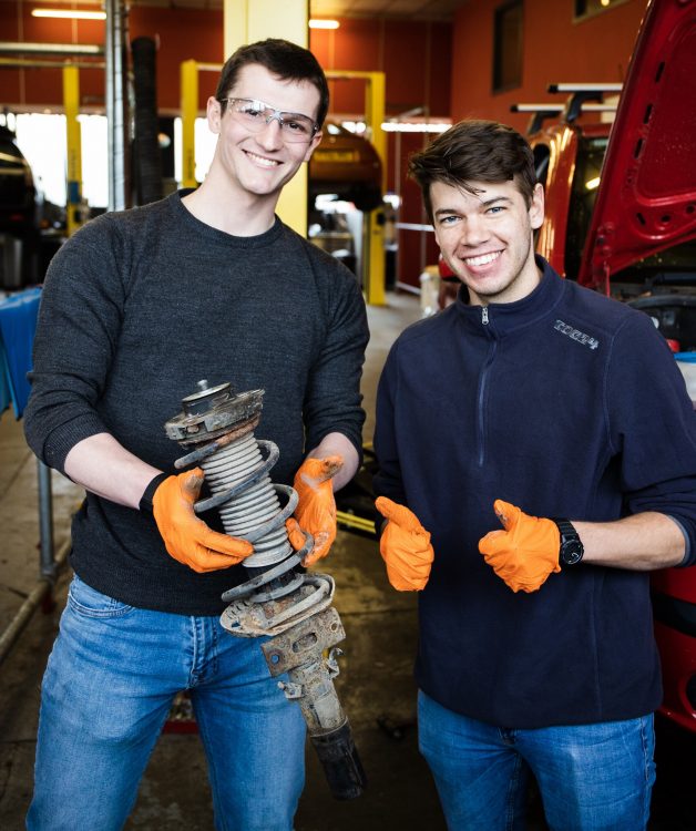 Ed Baker and Sean Selzer working on their car for the Mongol Rally