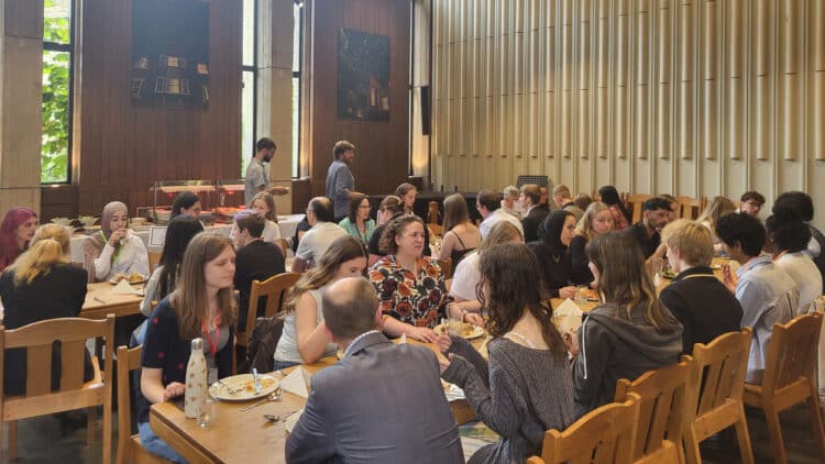 Prizewinners in the lunch Hall with tutors at St Edmund Hall