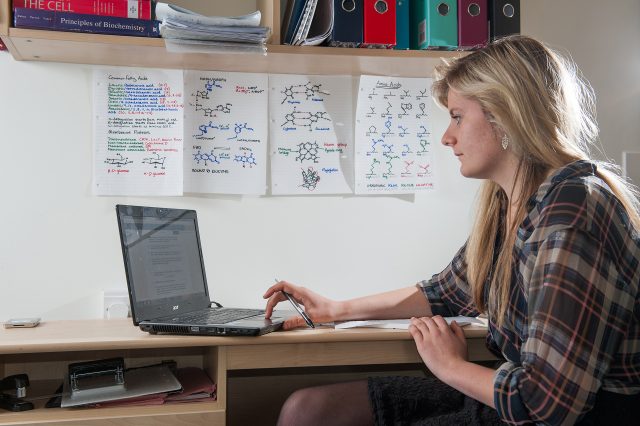 A Biochemistry student in her room