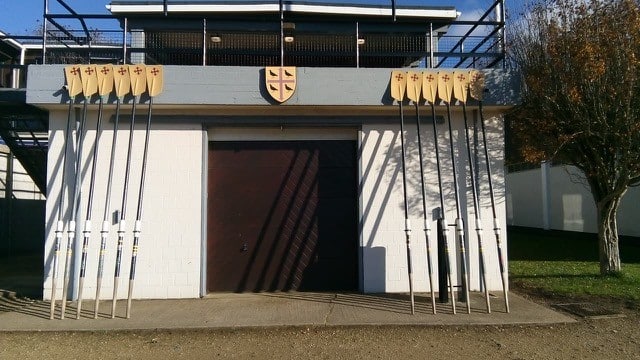 Blades laid out against the St Edmund Hall Boat House, in memory of club members who have lost their lives in war