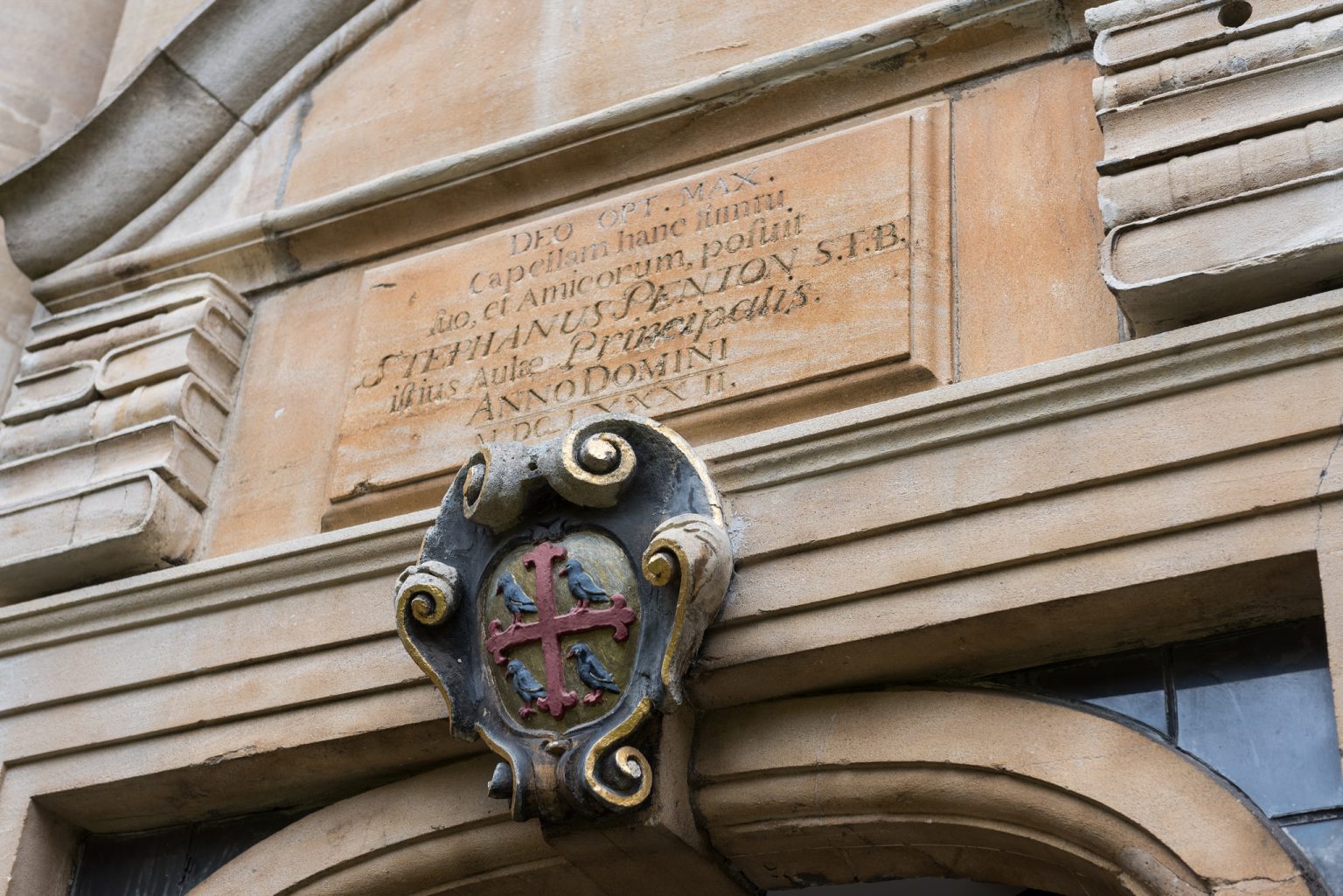 Stone books carved above the doorway to the Chapel