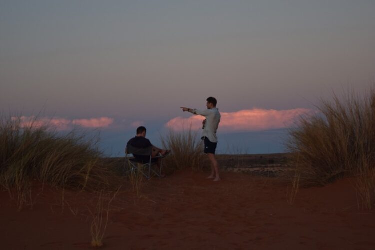 Charlie Knight and Callum Munday looking out at convective clouds over Botswana.