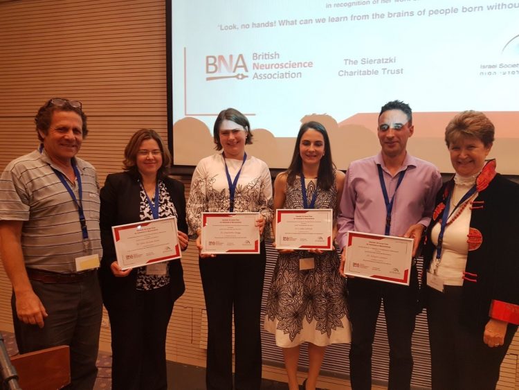 Charlie Stagg with the other Early Career Researcher Prize winners, and Prof. Illana Gozes, who awarded the prizes, and Prof. Hagai Bergman, President of ISFN