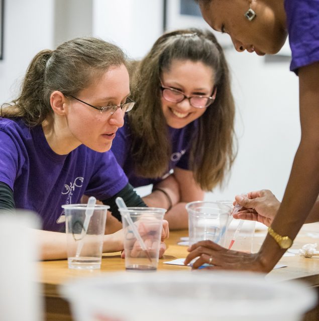 Students demonstrating an experiment at the College's Research Expo