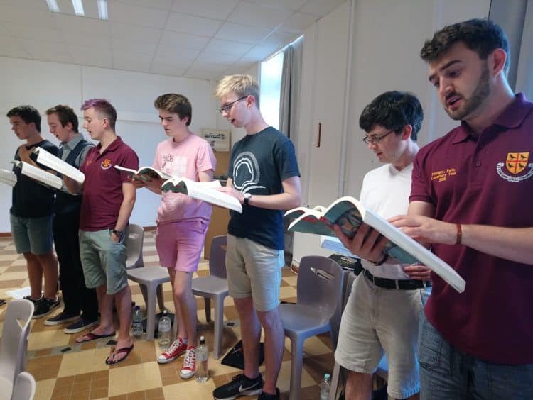 Choir practice during the tour to France