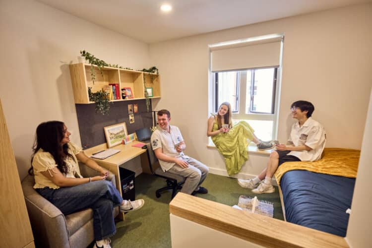 Four students sitting in a bedroom at Norham St Edmund