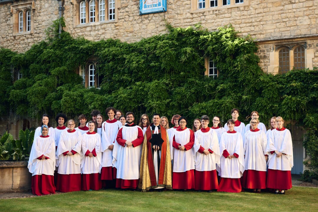 The College Choir dressed in the cossacks standing in the Front Quad