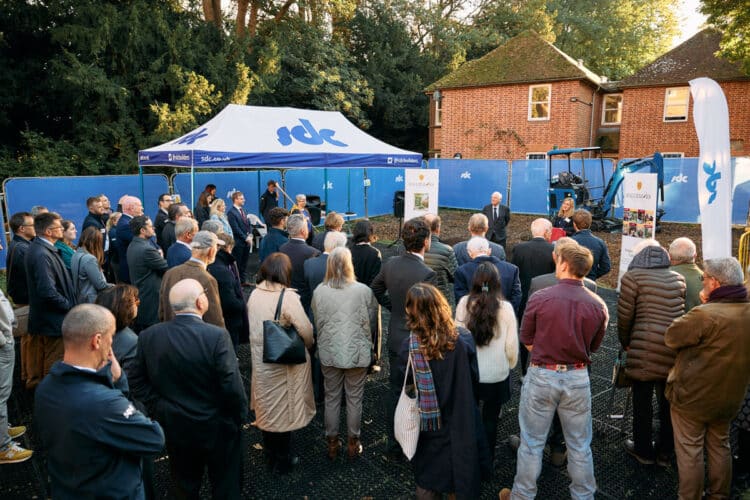 Guests listening to the speeches at breaking ground.