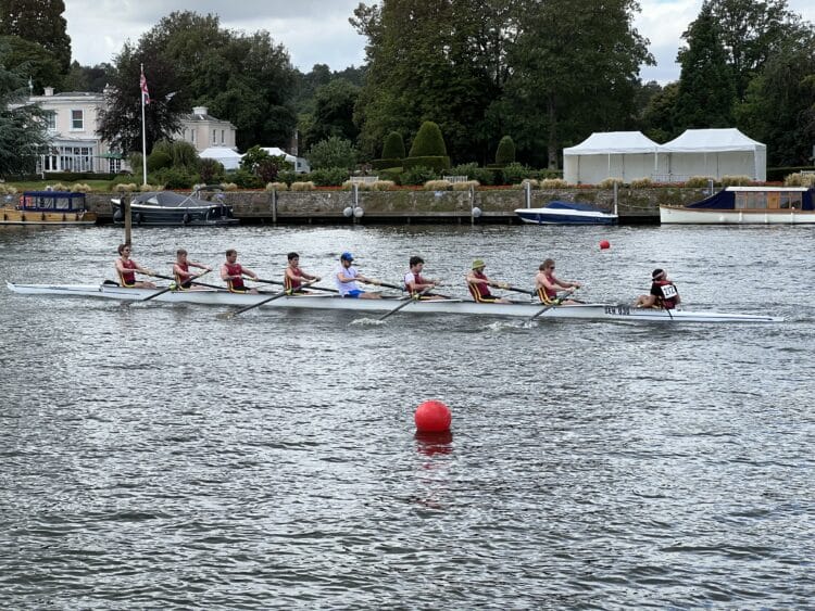 Students in a boat on the river Thames at Henley Town and Visitors Regatta