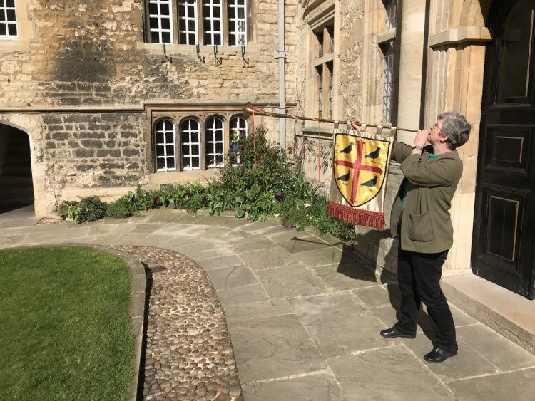 Henrike blowing her trumpet in the Front Quad