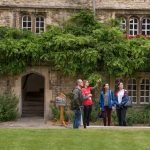 Student helpers showing visitors around the Front Quad during an Open Day