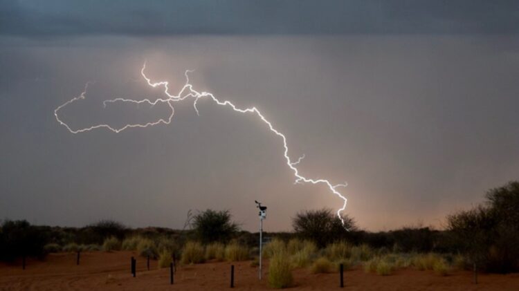 Lightning strikes behind the automatic weather station just south of Kgalagadi Transfrontier Park