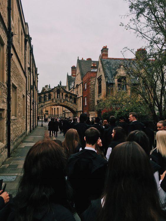 Postgraduate students walking to the Sheldonian for their matriculation ceremony