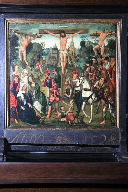 The scene of the Passion - Christ on the Cross at the centre wearing the Crown of Thorns