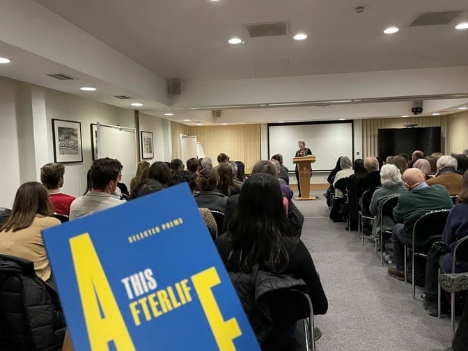 Poet speaking in Doctorow Hall to an audience of 60