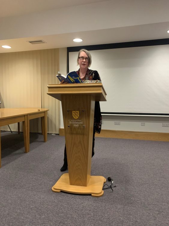 A E Stallings standing at Teddy Hall lectern