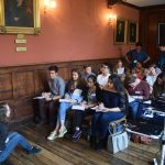 A St Edmund Hall undergraduate chats to prospective students during a workshop activity