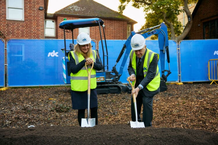 Principal and Chancellor breaking ground.