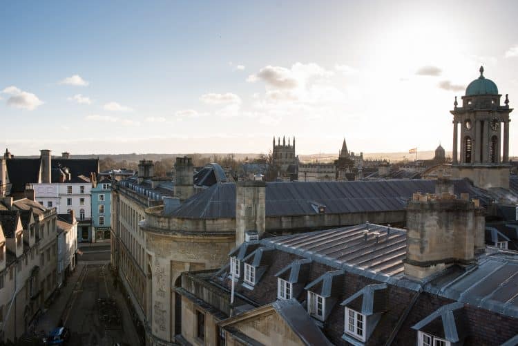 Students walking through the Front Quad The entrance to St Edmund Hall on Queen's Lane and the Oxford skyline