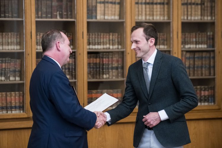 Václav receiving the prize from Professor Tomáš Zíma