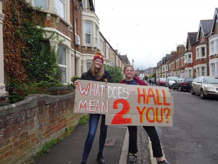 Rugby supporters with their sign on their way to the match