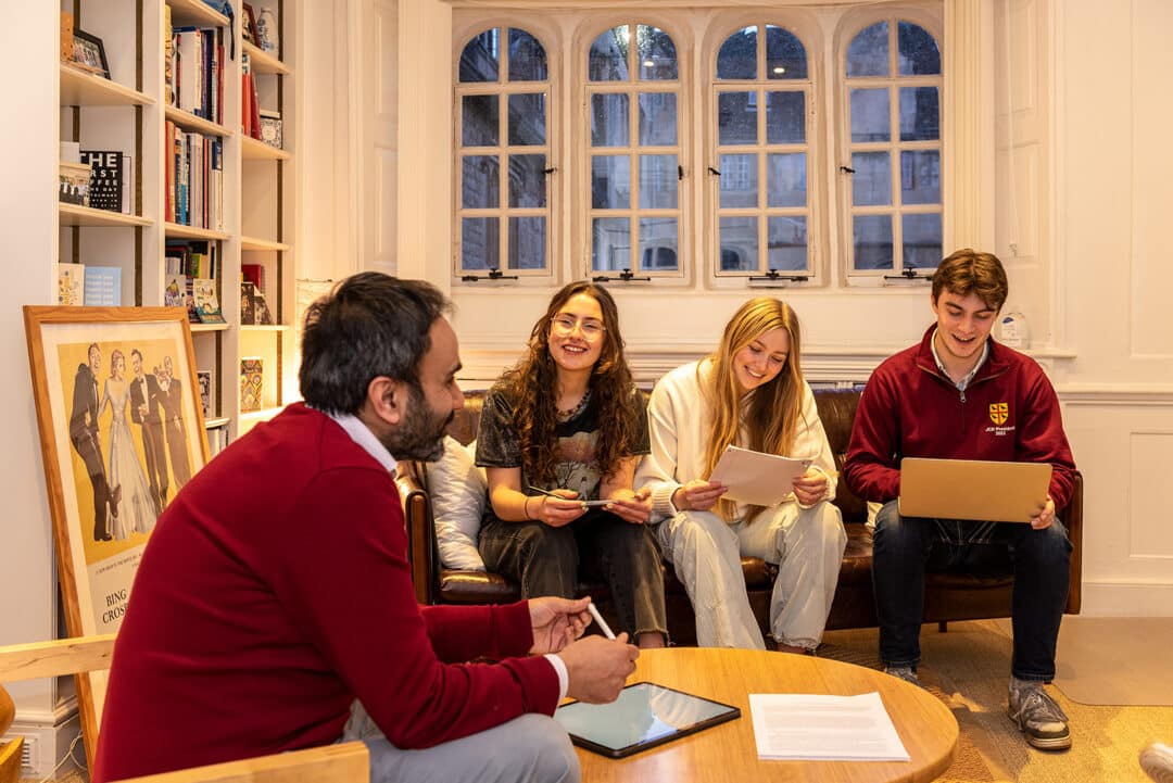 Science tutorial at Teddy Hall with tutor and 3 students sitting down