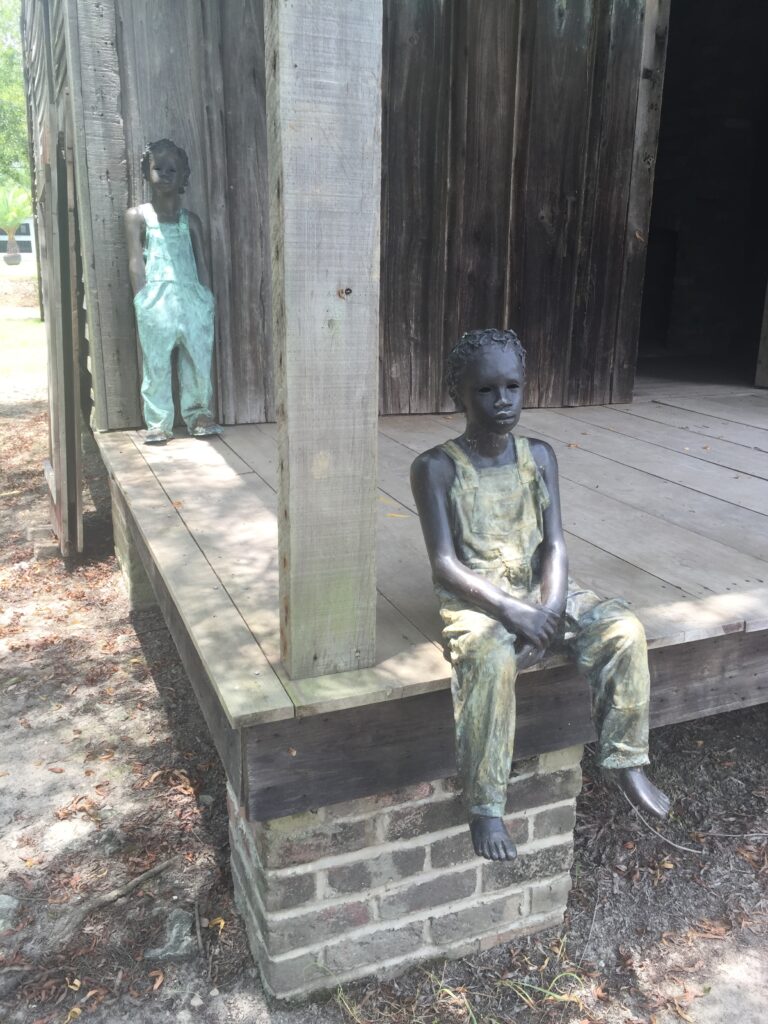 Statues of childrens at he slave quareters of Whiteny Plantation