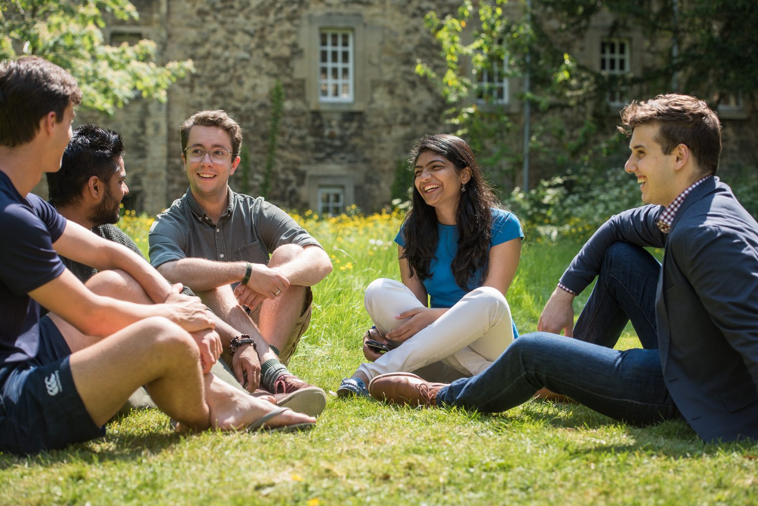 Students sitting in the College gardens