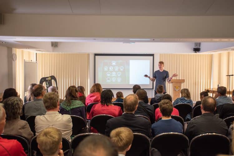 Dr Tom Crawford giving a talk at Access Hall Areas Dr Tom Crawford giving a talk at Access Hall Areas