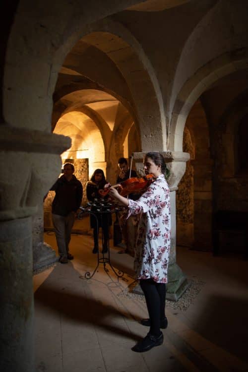 Postgraduate student Andrea Fortier performs a viola recital in the Crypt