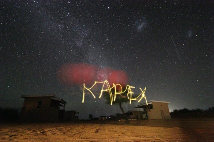 The Milky Way, Large Magellanic Cloud and Small Magellanic Cloud are visible in the night sky, as are two satellites in low-earth orbit