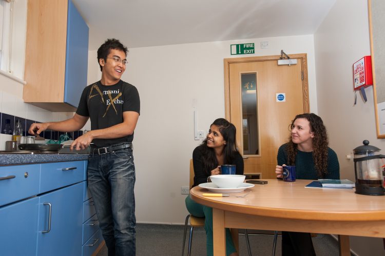 Visiting Students in a shared kitchen in the William R. Miller building
