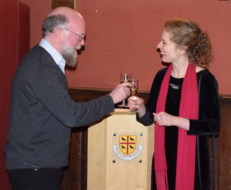 Dr Chris Lewis and Dr Emily Winkler raise a toast at the book launch
