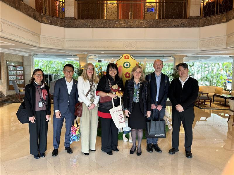 A photo of a group of Aularians posing together at the 2025 Hong Kong Drinks Reception